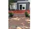 Backyard deck with slider access to house plus brick patio with flowers at 9008 W 101St Ave, Broomfield, CO 80021