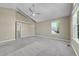 Spacious carpeted bedroom featuring neutral walls, vaulted ceiling, and a window at 9008 W 101St Ave, Broomfield, CO 80021