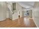 Open-concept living space with hardwood floors, staircase, and abundant natural light at 9008 W 101St Ave, Broomfield, CO 80021
