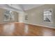 Bright living room with hardwood floors, large windows, and vaulted ceilings at 9008 W 101St Ave, Broomfield, CO 80021