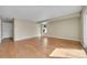Bright living room showcasing hardwood floors, neutral walls, and natural light from the window at 9008 W 101St Ave, Broomfield, CO 80021