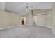 Spacious carpeted bedroom featuring vaulted ceiling and entryways to other areas of the home at 9008 W 101St Ave, Broomfield, CO 80021