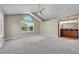 Spacious carpeted bedroom with vaulted ceiling, window, and en-suite bathroom at 9008 W 101St Ave, Broomfield, CO 80021