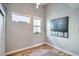 This bedroom features warm hardwood floors, sleek modern trim, and natural light at 2833 W 25Th Ave # 5, Denver, CO 80211
