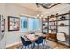 Bright dining area with hardwood floors, modern chandelier, a built-in desk, and plenty of natural light at 2833 W 25Th Ave # 5, Denver, CO 80211
