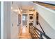 Hallway with wooden floors, steel railing, laundry, and decor at 2833 W 25Th Ave # 5, Denver, CO 80211