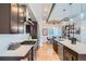 Modern kitchen features dark wood cabinetry, stainless steel appliances, and a large island with counter seating at 2833 W 25Th Ave # 5, Denver, CO 80211