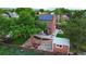 Backyard with a cozy patio, equipped with solar panels, a fire pit, and a wooden fence at 4664 S Union St, Morrison, CO 80465