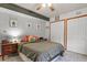 Nicely decorated bedroom with ample closet space, wood trim and bedside table with lamp at 4664 S Union St, Morrison, CO 80465