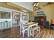 Inviting dining space with a view of the kitchen, creating a warm and connected atmosphere at 4664 S Union St, Morrison, CO 80465