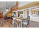 Dining area showcasing high ceilings, a loft and an open layout to the living room and kitchen at 4664 S Union St, Morrison, CO 80465
