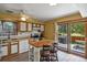 Well-appointed kitchen with an island and easy access to an outdoor patio at 4664 S Union St, Morrison, CO 80465