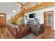 Inviting living room with hardwood floors and a staircase leading to the upper level at 4664 S Union St, Morrison, CO 80465