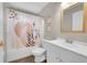 Bathroom featuring a shower with a patterned curtain and a modern vanity at 4259 S Richfield St, Aurora, CO 80013