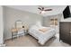 Comfortable bedroom with neutral tones, a desk, carpet and a ceiling fan at 4259 S Richfield St, Aurora, CO 80013