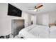 Main bedroom with a dresser, wall-mounted TV, and carpeted floor at 4259 S Richfield St, Aurora, CO 80013
