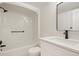 Clean, modern bathroom with white tub, shower, toilet, vanity, and updated fixtures at 12593 E Pacific Cir # E, Aurora, CO 80014