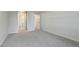 Bedroom with carpeted floors, large closet, and doorway to an ensuite bathroom at 12593 E Pacific Cir # E, Aurora, CO 80014
