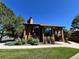 Brick clubhouse with large windows, lush landscaping, and community amenities at 12593 E Pacific Cir # E, Aurora, CO 80014