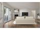 View of the living room with fireplace, sliding glass doors, a contemporary decor, and plenty of natural light at 12593 E Pacific Cir # E, Aurora, CO 80014