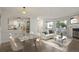 Open-concept living space with modern furnishings, a fireplace, and natural light, adjacent to the kitchen at 12593 E Pacific Cir # E, Aurora, CO 80014