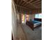 Partially completed bedroom featuring a rustic bed frame and in-progress ceiling at 325 Aspen Rd, Idaho Springs, CO 80452