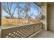 Back porch, with outdoor views of a well maintained grassy yard and secure wooden privacy fence at 9742 E Hawaii Pl, Aurora, CO 80247