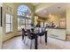 Bright dining area with modern chandelier and open layout, perfect for Gathering meals and entertaining guests at 9742 E Hawaii Pl, Aurora, CO 80247