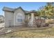 Charming home exterior features neutral siding, manicured landscaping, and a covered porch at 9742 E Hawaii Pl, Aurora, CO 80247