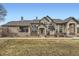 Charming two-story home with mature landscaping, a well-manicured lawn, and inviting curb appeal at 9742 E Hawaii Pl, Aurora, CO 80247