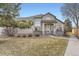 Charming single-Gathering home with a well-manicured lawn, inviting entryway, and attractive architectural details at 9742 E Hawaii Pl, Aurora, CO 80247