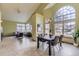 Inviting living area with vaulted ceilings, large windows, and an open layout, creating a bright and airy space at 9742 E Hawaii Pl, Aurora, CO 80247