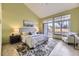 Bright main bedroom with a large window, ensuite access, and elegant floral rug at 9742 E Hawaii Pl, Aurora, CO 80247