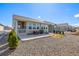Backyard with lawn, gravel, patio, outdoor seating and grill, with partial view of nearby properties at 15979 Xanthia Way, Thornton, CO 80602