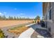 Fenced backyard featuring a lawn, gravel landscaping, and concrete patio at 15979 Xanthia Way, Thornton, CO 80602