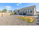 Wide backyard features well kept lawn, gravel, and patio with outdoor seating and grill at 15979 Xanthia Way, Thornton, CO 80602