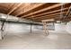 Unfinished basement with concrete floor and exposed ceiling, offering potential for customization and additional living space at 15979 Xanthia Way, Thornton, CO 80602