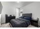 Bedroom with dark furnishings, plush bedding, and natural light at 15979 Xanthia Way, Thornton, CO 80602