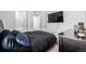 Spacious bedroom featuring a mounted television and ample storage at 15979 Xanthia Way, Thornton, CO 80602