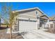 Charming home featuring neutral siding, a cozy front porch, and a well-maintained lawn at 15979 Xanthia Way, Thornton, CO 80602