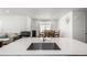Bright open floor plan features an island overlooking the living and dining area at 15979 Xanthia Way, Thornton, CO 80602