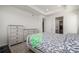 Comfortable main bedroom features tray ceiling, dresser set and walk-in closet at 15979 Xanthia Way, Thornton, CO 80602