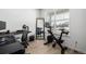 Bright home office space with modern desk and exercise equipment at 15979 Xanthia Way, Thornton, CO 80602