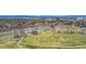 Aerial view of park including lake, and green spaces near neighborhood and downtown at 1050 S Monaco Pkwy # 42, Denver, CO 80224