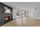 Bright living room with fireplace and sliding glass doors leading to a patio at 3369 S Monaco Street Pkwy # A, Denver, CO 80222