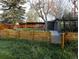 Backyard showcasing a putting green, detached building, and a charming wooden fence at 9380 W 51St Ave, Arvada, CO 80002