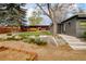 Large backyard featuring a putting green, seating, and lush landscaping at 9380 W 51St Ave, Arvada, CO 80002