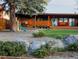 View of a backyard with a gazebo, play set, putting green, and a modern home at 9380 W 51St Ave, Arvada, CO 80002
