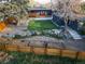 Landscaped backyard with a putting green, garden beds, and a charming patio area at 9380 W 51St Ave, Arvada, CO 80002