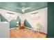 Eclectic bedroom with a rocking chair and an interesting teal and white design at 9380 W 51St Ave, Arvada, CO 80002